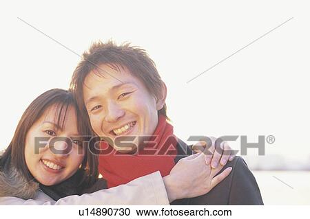 Stock Image - Young couple hugging. Fotosearch