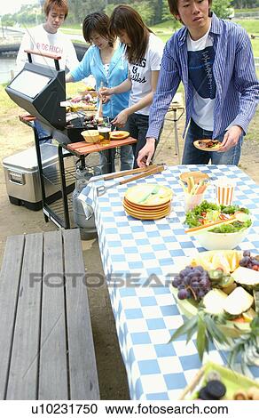 Young People Doing BBQ View Large Photo Image Stock Image - Young People Doing BBQ. Fotosearch