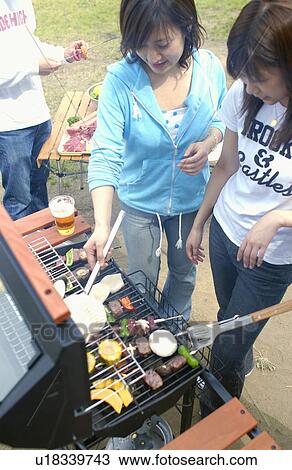 Young People Doing BBQ View Large Photo Image Stock Image - Young People Doing BBQ. Fotosearch
