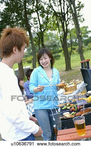 Young people enjoying barbecue, Tokyo Prefecture, Honshu, Japan View Large Photo Image Stock Image - Young people enjoying barbecue, Tokyo Prefecture, Honshu, Japan. Fotosearch