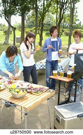 Young people enjoying barbecue, Tokyo Prefecture, Honshu, Japan View Large Photo Image Stock Image - Young people enjoying barbecue, Tokyo Prefecture, Honshu, Japan. Fotosearch