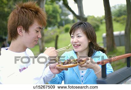 Young people enjoying barbecue, Tokyo Prefecture, Honshu, Japan View Large Photo Image Stock Photo - Young people enjoying barbecue, Tokyo Prefecture, Honshu, Japan. Fotosearch