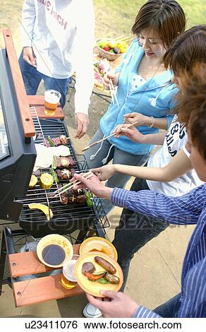 Young people enjoying barbecue, Tokyo Prefecture, Honshu, Japan View Large Photo Image Stock Photograph - Young people enjoying barbecue, Tokyo Prefecture, Honshu, Japan. Fotosearch