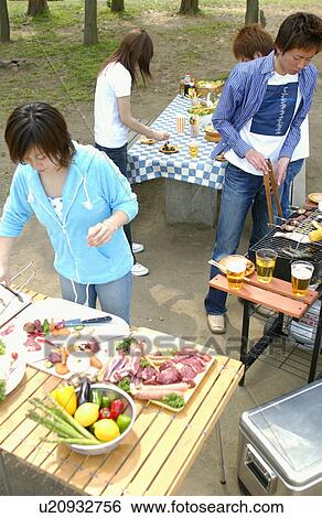 Young people preparing barbecue, Tokyo Prefecture, Honshu, Japan View Large Photo Image Stock Photograph - Young people preparing barbecue, Tokyo Prefecture, Honshu, Japan. Fotosearch