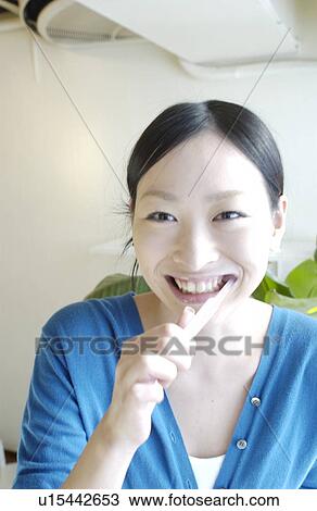 Young woman brushing teeth View Large Photo Image Stock Image - Young woman brushing teeth. Fotosearch