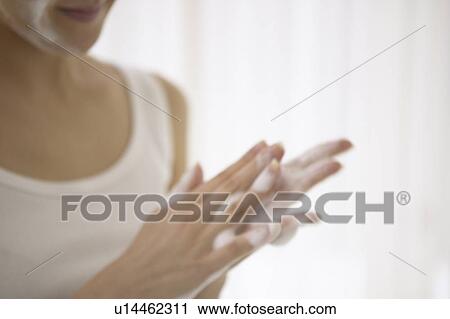 Young woman making soap suds with hands, close up View Large Photo Image Stock Image - Young woman making soap suds with hands, close up. Fotosearch