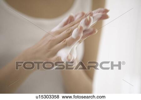 Young woman making soap suds with hands, close up View Large Photo Image Stock Photo - Young woman making soap suds with hands, close up. Fotosearch