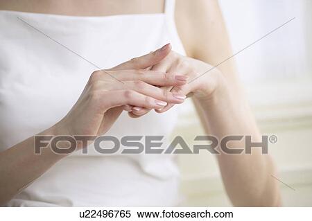 Young woman massaging hands, close up View Large Photo Image Stock Photography - Young woman massaging hands, close up. Fotosearch