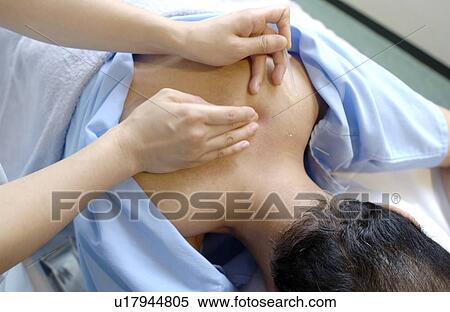 Young woman putting acupuncture needles on man's shoulders, close up View Large Photo Image Stock Photography - Young woman putting acupuncture needles on man's shoulders, close up. Fotosearch