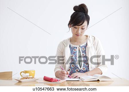Young woman studying View Large Photo Image Stock Image - Young woman studying. Fotosearch