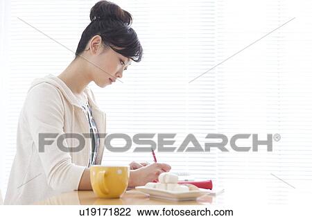 Young woman studying View Large Photo Image Stock Image - Young woman studying. Fotosearch