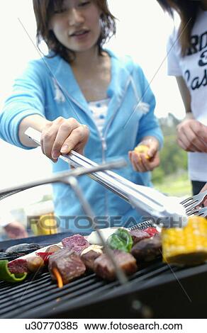 Young Women Doing BBQ View Large Photo Image Stock Photography - Young Women Doing BBQ. Fotosearch