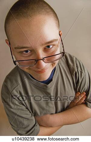 a boy with eye glasses sliding down his nose View Large Photo Image Stock Photo - a boy with eye glasses sliding down his nose. Fotosearch