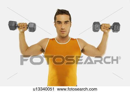Stock Image - a man lifting two free weights. Fotosearch
