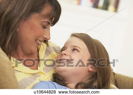 Stock Photo - a mother and daughter looking at each other. Fotosearch