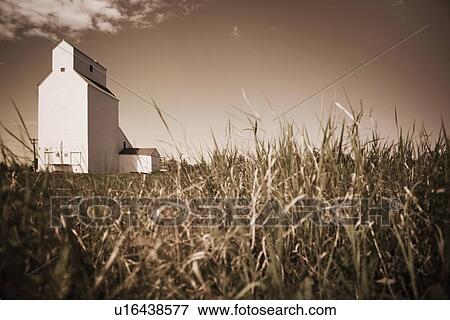 Stock Photo - alberta, canada; a grain elevator. Fotosearch