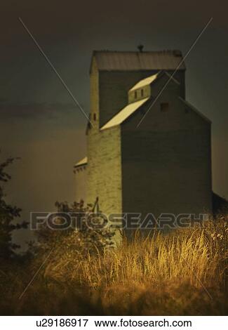 Stock Photo - alberta, canada; a grain elevator. Fotosearch