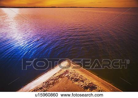 alberta, canada; a pier on the lake at sunset View Large Photo Image Stock Image - alberta, canada; a pier on the lake at sunset. Fotosearch
