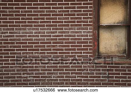 alberta, canada; a red brick wall with a boarded up window View Large Photo Image Stock Photograph - alberta, canada; a red brick wall with a boarded up window. Fotosearch