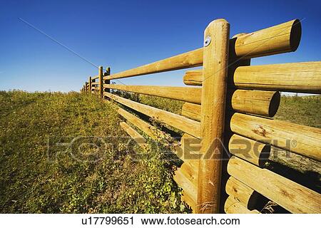 Stock Image - alberta, canada; a wooden rail fence. Fotosearch