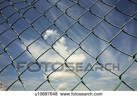 alberta, canada; the sky through a chain link fence View Large Photo Image Stock Photo - alberta, canada; the sky through a chain link fence. Fotosearch