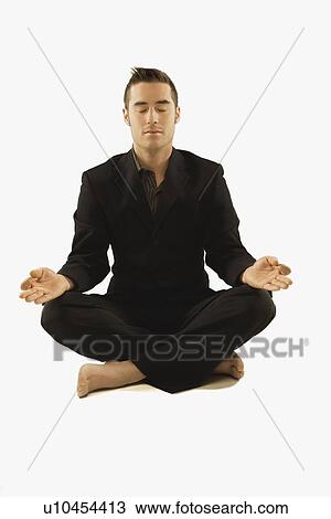 businessman in a yoga pose wearing a suit View Large Photo Image Stock Image - businessman in a yoga pose wearing a suit. Fotosearch