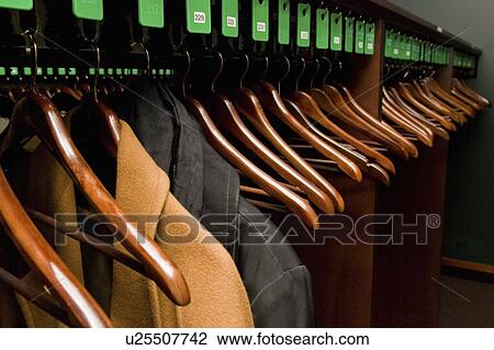 Stock Image - edmonton, alberta, canada; a coat check used as a fundraiser for the edmonton symphony orchestra. Fotosearch