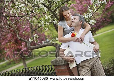 Stock Photography - edmonton, alberta, canada; a couple looking at each other. Fotosearch