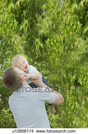 Picture - edmonton, alberta, canada; a father playing with his young son. Fotosearch