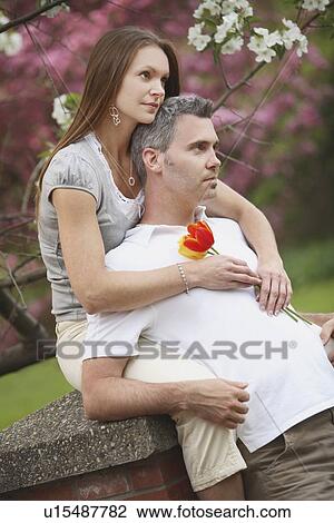 edmonton, alberta, canada; a man and woman together in a park View Large Photo Image Stock Image - edmonton, alberta, canada; a man and woman together in a park. Fotosearch