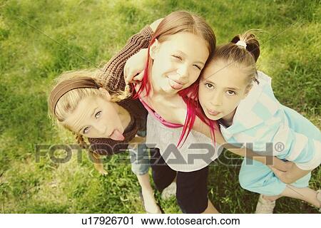 edmonton, alberta, canada; three girls sticking out their tongues View Large Photo Image Stock Image - edmonton, alberta, canada; three girls sticking out their tongues. Fotosearch