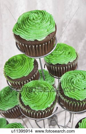 green icing on chocolate cupcakes for saint patrick's day View Large Photo Image Picture - green icing on chocolate cupcakes for saint patrick's day. Fotosearch