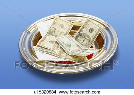 knoxville, tennessee, united states of america; american money in a church offering plate View Large Photo Image Picture - knoxville, tennessee, united states of america; american money in a church offering plate. Fotosearch