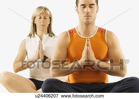 man and woman in a yoga pose View Large Photo Image Stock Photo - man and woman in a yoga pose. Fotosearch