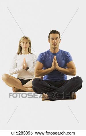 man and woman in a yoga pose View Large Photo Image Stock Photography - man and woman in a yoga pose. Fotosearch