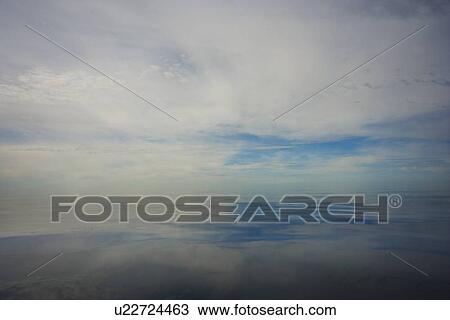 Stock Image - northwest territories, canada; reflection of the sky in the arctic ocean. Fotosearch