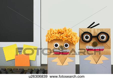 paper bag people representing tech support standing beside a computer View Large Photo Image Stock Photo - paper bag people representing tech support standing beside a computer. Fotosearch