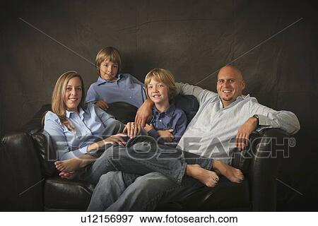 portrait of a family on a couch View Large Photo Image Stock Photo - portrait of a family on a couch. Fotosearch
