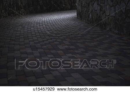Stock Photo - san antonio, texas, united states of america; a brick walkway in the dark. Fotosearch