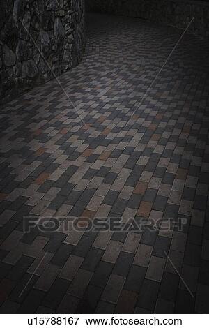 Stock Photo - san antonio, texas, united states of america; a brick walkway in the dark. Fotosearch
