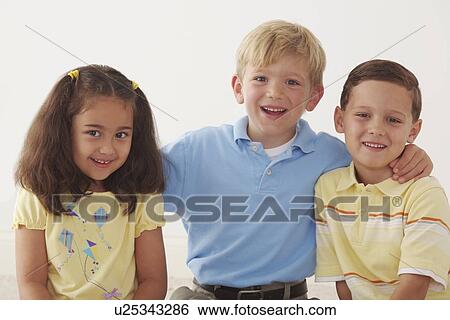 Stock Photograph - three children in an embrace. Fotosearch