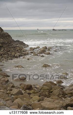 Stock Photo - water against a rocky shore. Fotosearch