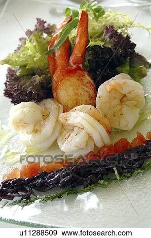 Stock Photo - A dish of lobster, scampi and salad. Fotosearch