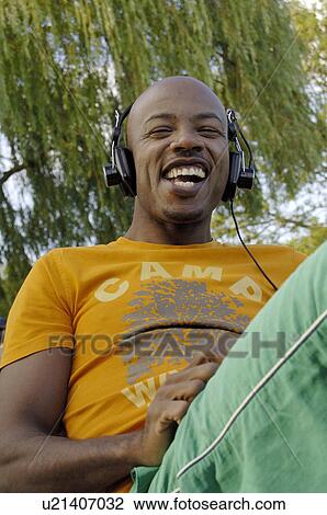 African listening to music and sings View Large Photo Image Stock Image - African listening to music and sings. Fotosearch