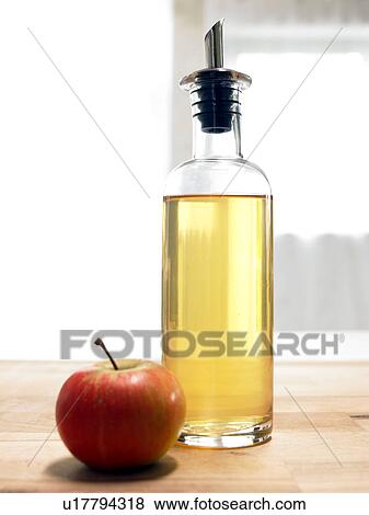 Stock Photo - Apple and cider vinegar. Fotosearch