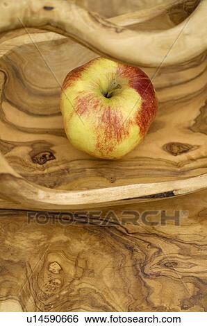 Apple in wooden bowl View Large Photo Image Stock Photograph - Apple in wooden bowl. Fotosearch