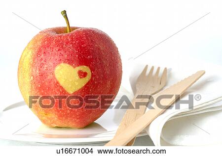 Picture - Apple with a heart pattern. Fotosearch
