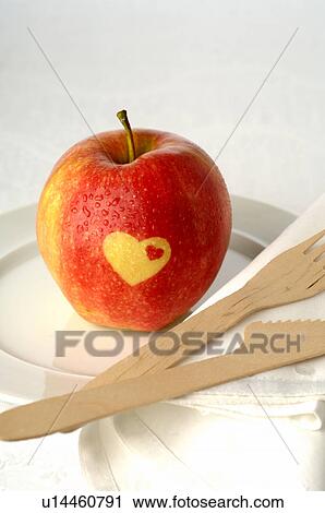 Apple with a heart pattern View Large Photo Image Stock Image - Apple with a heart pattern. Fotosearch