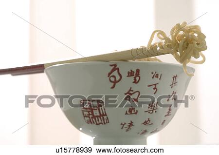 Asian bowl with chopsticks and noodles View Large Photo Image Stock Photo - Asian bowl with chopsticks and noodles. Fotosearch