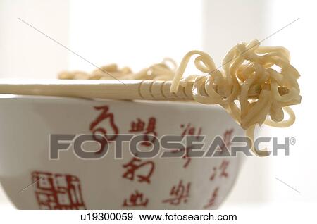 Asian bowl with chopsticks and noodles View Large Photo Image Stock Photo - Asian bowl with chopsticks and noodles. Fotosearch